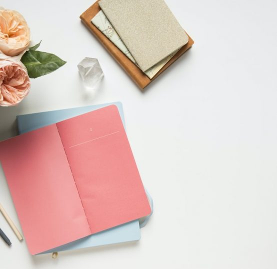 Books and flowers on a table